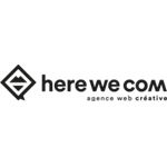 HERE WE COM Logo